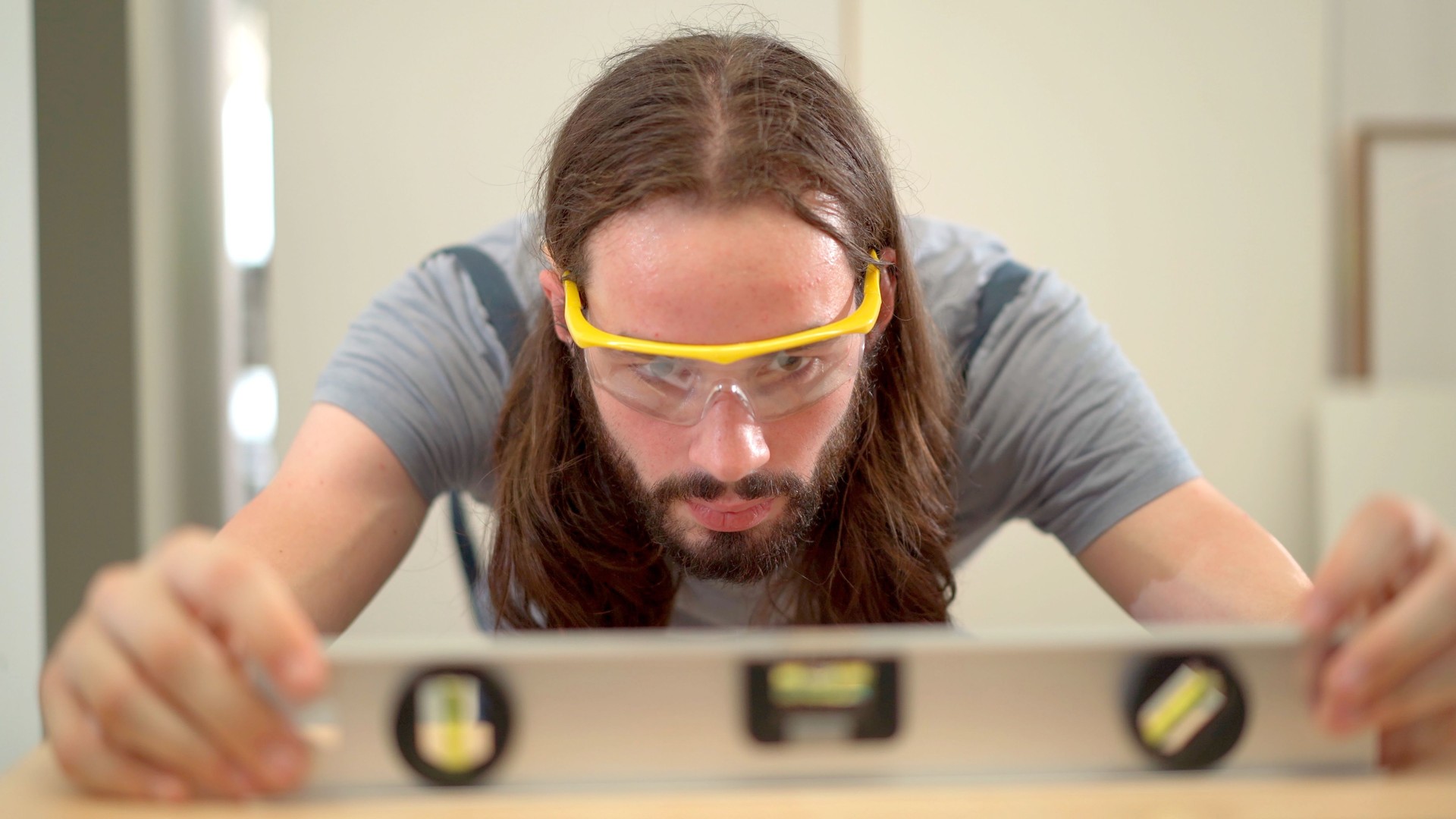 Technician measuring a balance level of work piece.